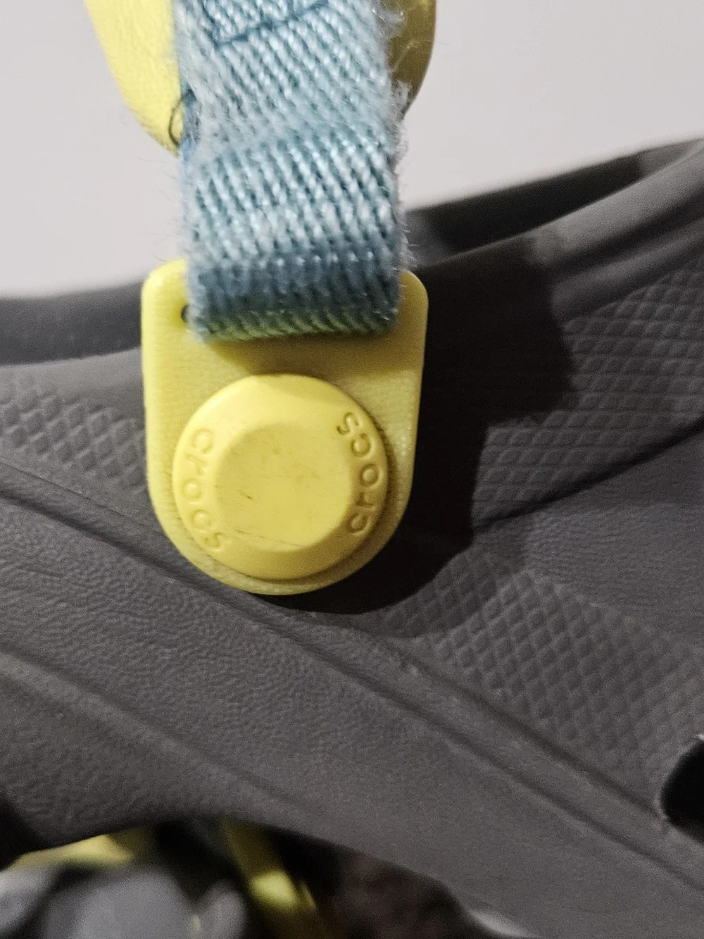 CROCS Kids Gray Clogs with Yellow and Blue Accents